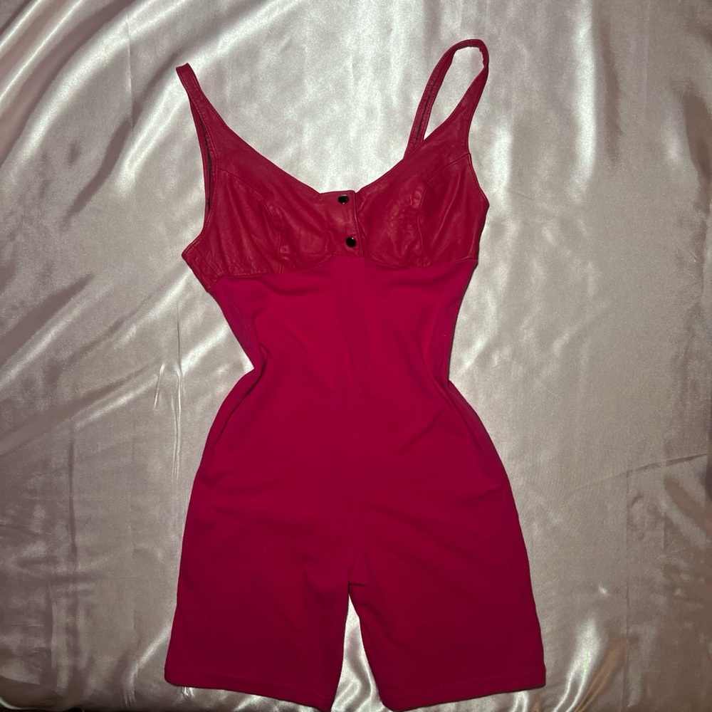 Unique Hot Pink romper with genuine leather around bra are